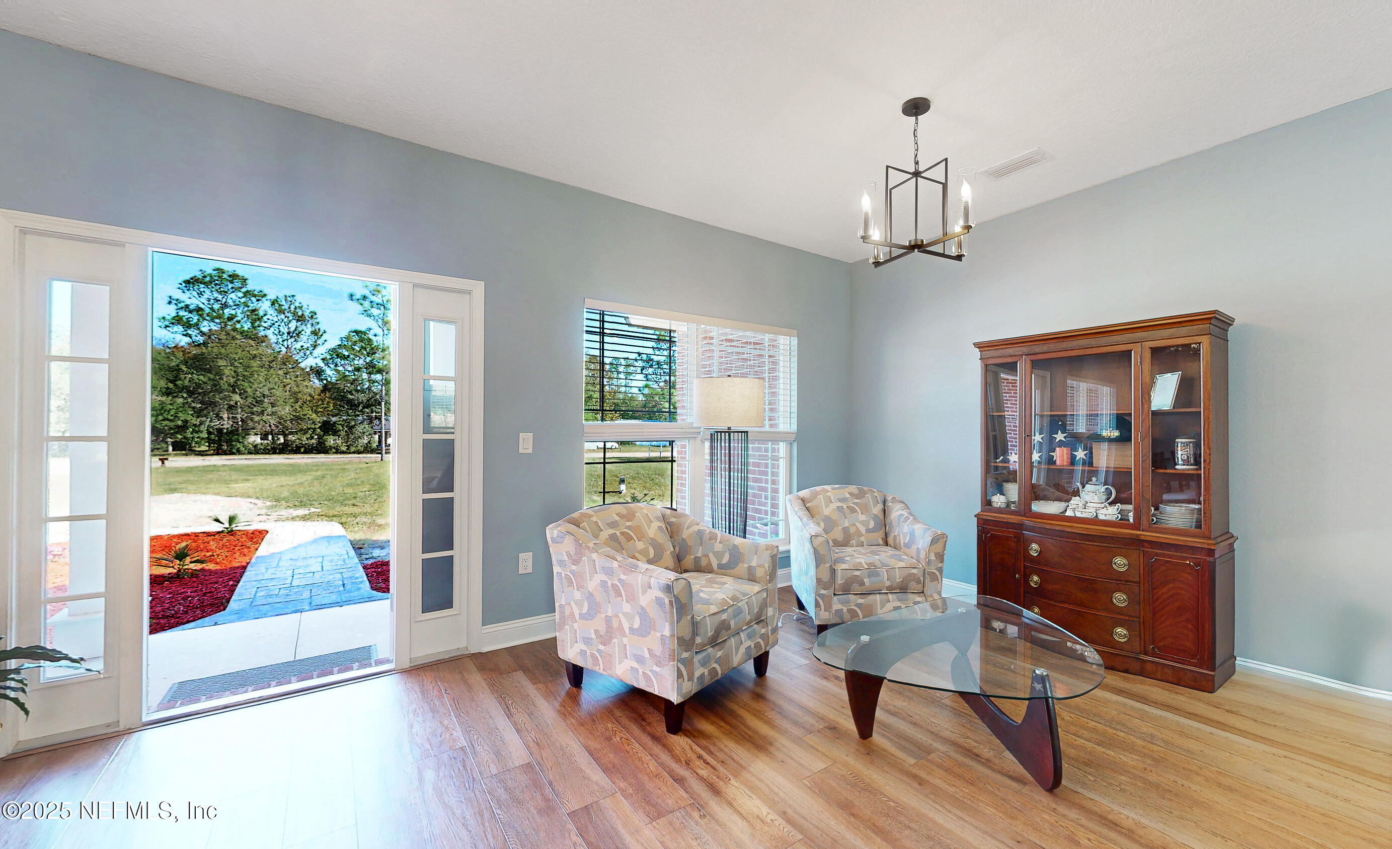 2414 Range Line Road Middleburg, FL 32068 - Photo 11 of 39 a living room with furniture and a large window