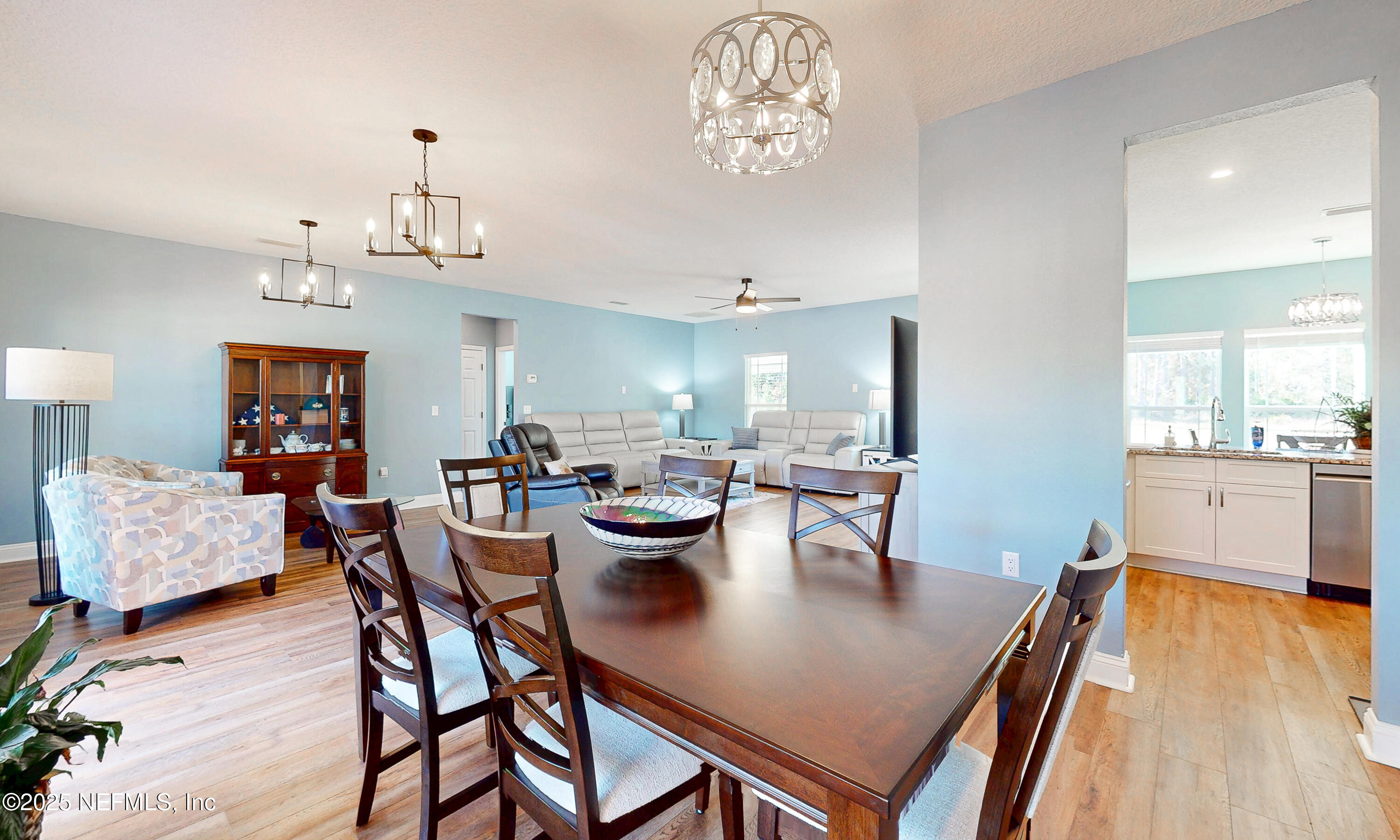 2414 Range Line Road Middleburg, FL 32068 - Photo 13 of 39 a view of a dining room with furniture and wooden floor
