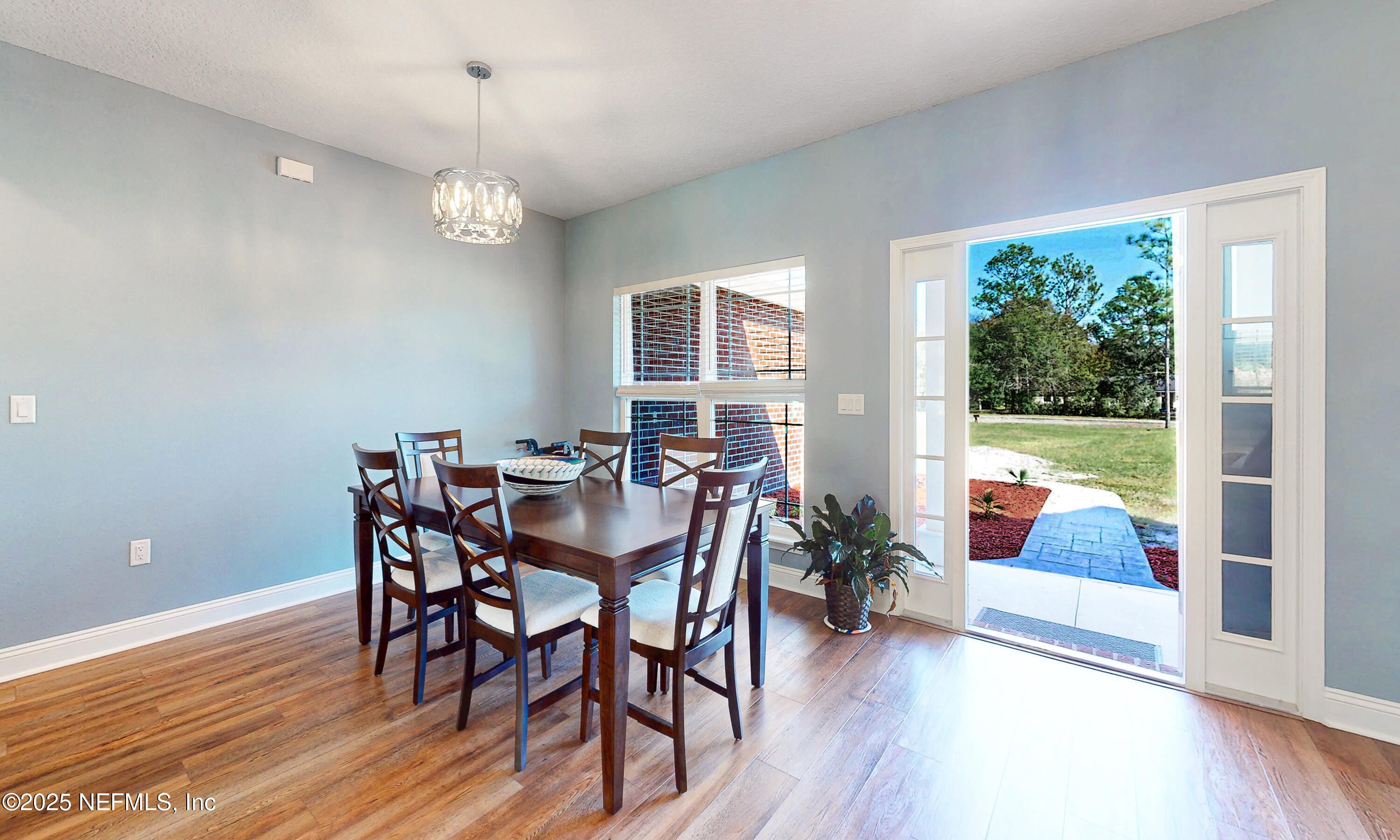 2414 Range Line Road Middleburg, FL 32068 - Photo 14 of 39 a view of a dining room with furniture window and wooden floor