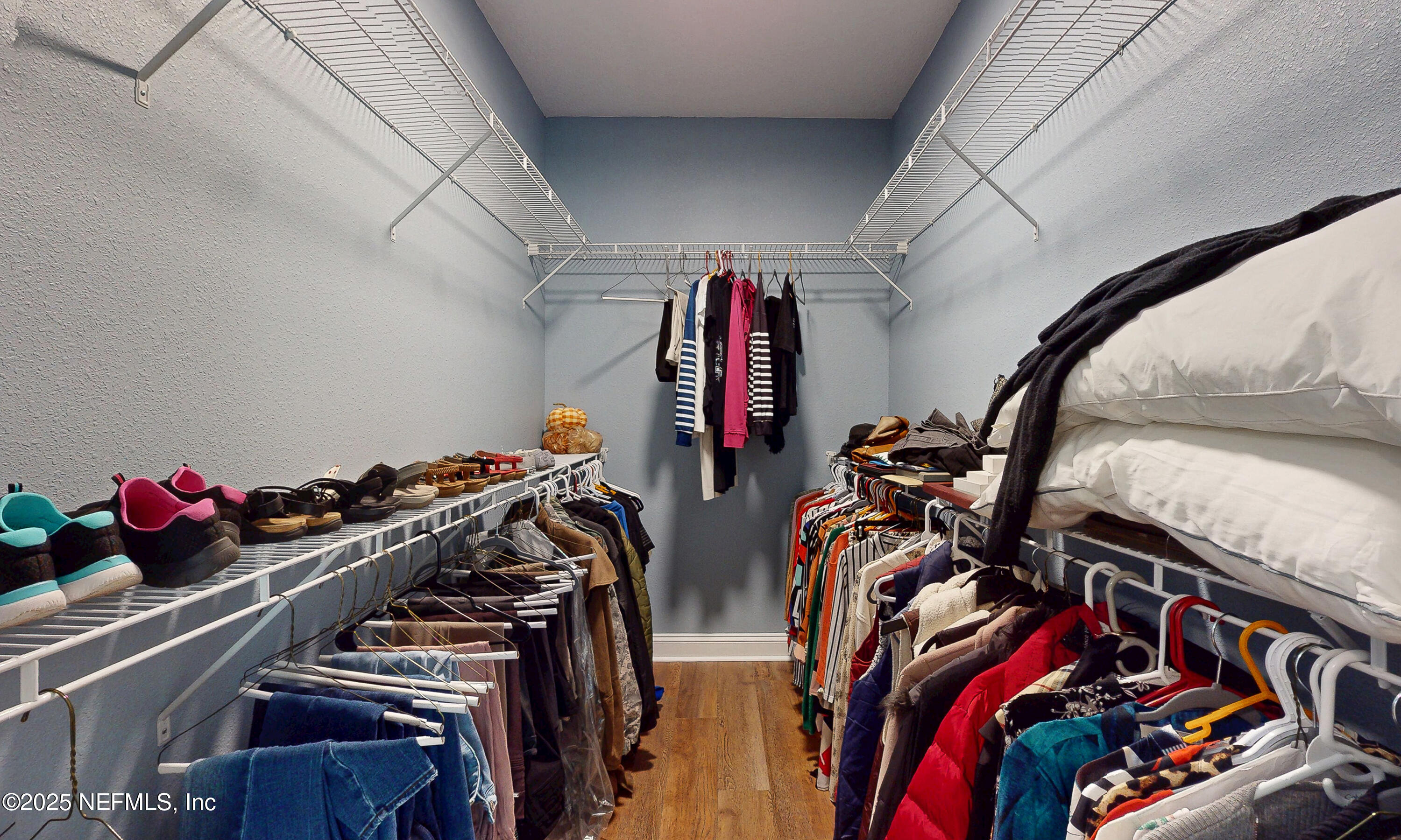 2414 Range Line Road Middleburg, FL 32068 - Photo 22 of 39 a view of walk in closet with clothes and shoes