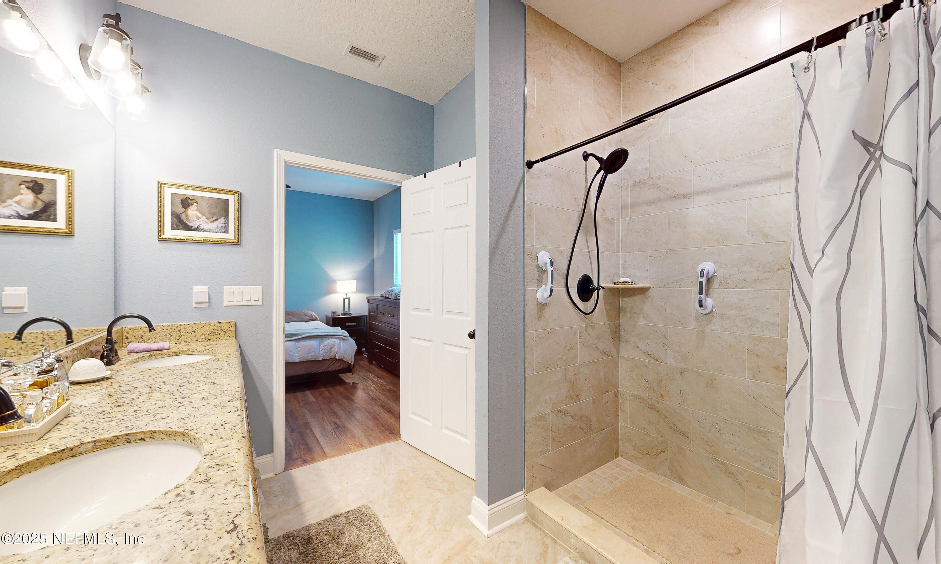 2414 Range Line Road Middleburg, FL 32068 - Photo 24 of 39 a bathroom with a granite countertop sink a mirror and shower