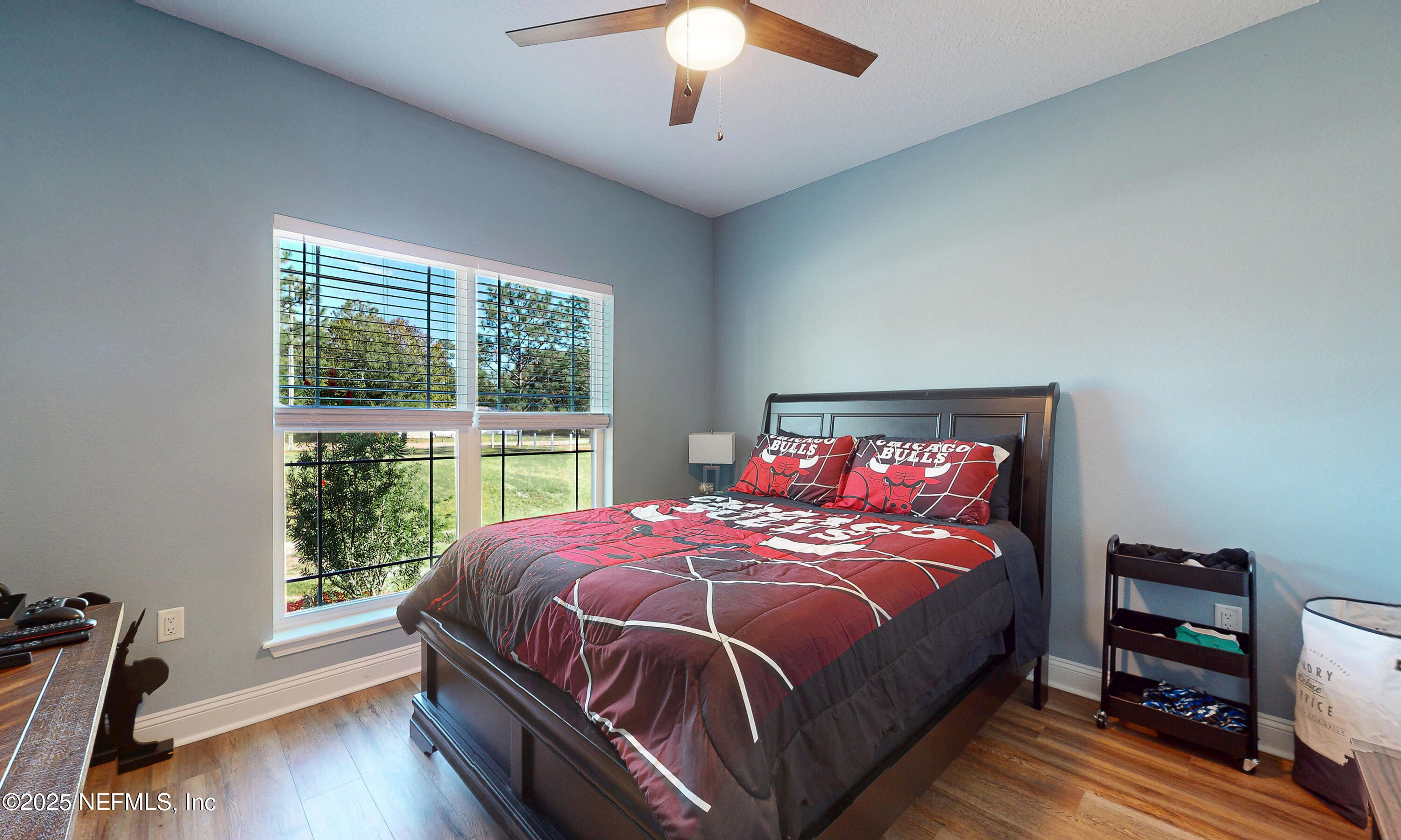 2414 Range Line Road Middleburg, FL 32068 - Photo 25 of 39 a bed sitting in a bedroom next to a window