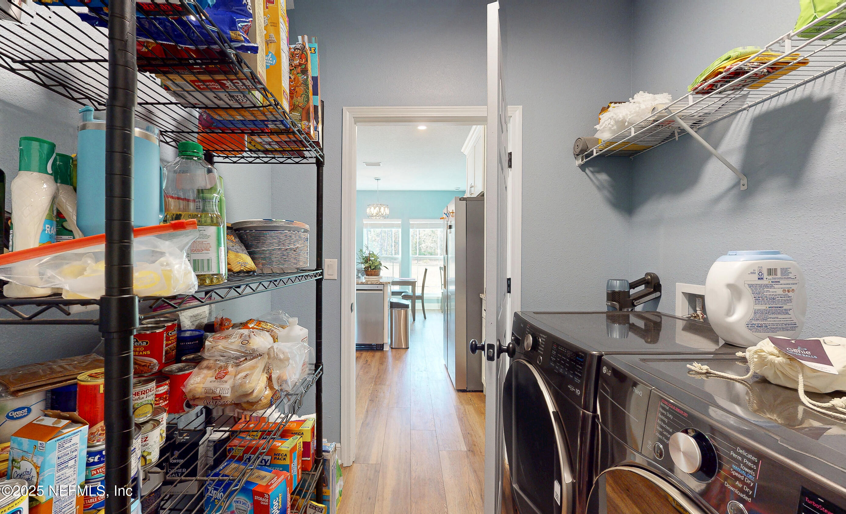 2414 Range Line Road Middleburg, FL 32068 - Photo 30 of 39 a view of walk in closet with clothes and shoes