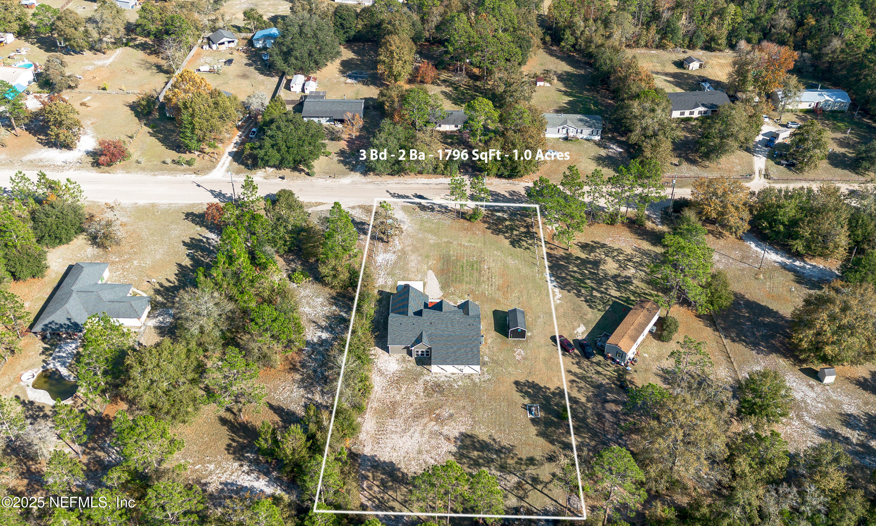 2414 Range Line Road Middleburg, FL 32068 - Photo 38 of 39 an aerial view of residential houses with outdoor space