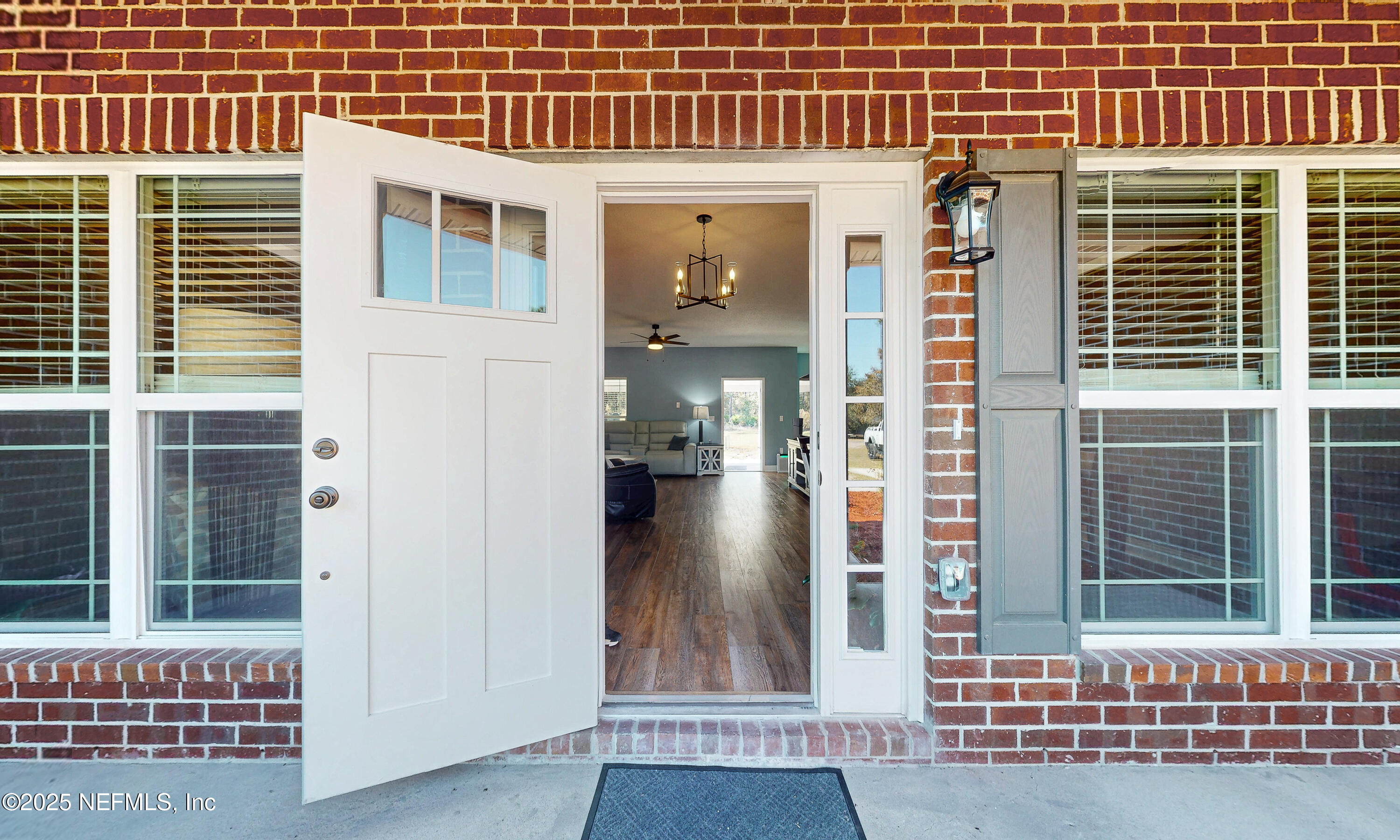 2414 Range Line Road Middleburg, FL 32068 - Photo 4 of 39 a view of a brick house with large windows