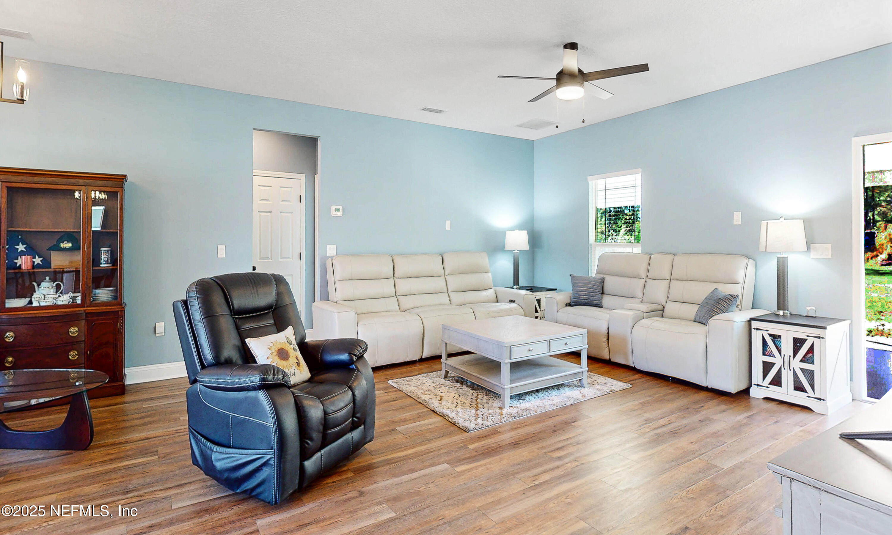 2414 Range Line Road Middleburg, FL 32068 - Photo 8 of 39 a living room with furniture and a wooden floor