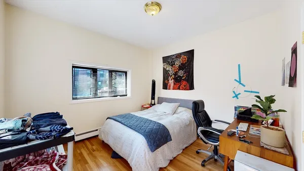 a bedroom with bed and a window