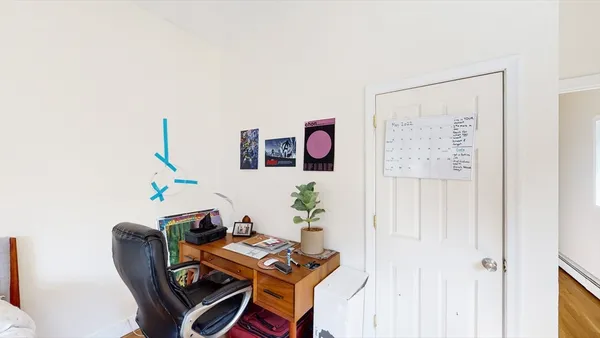 a workspace with furniture and book shelf