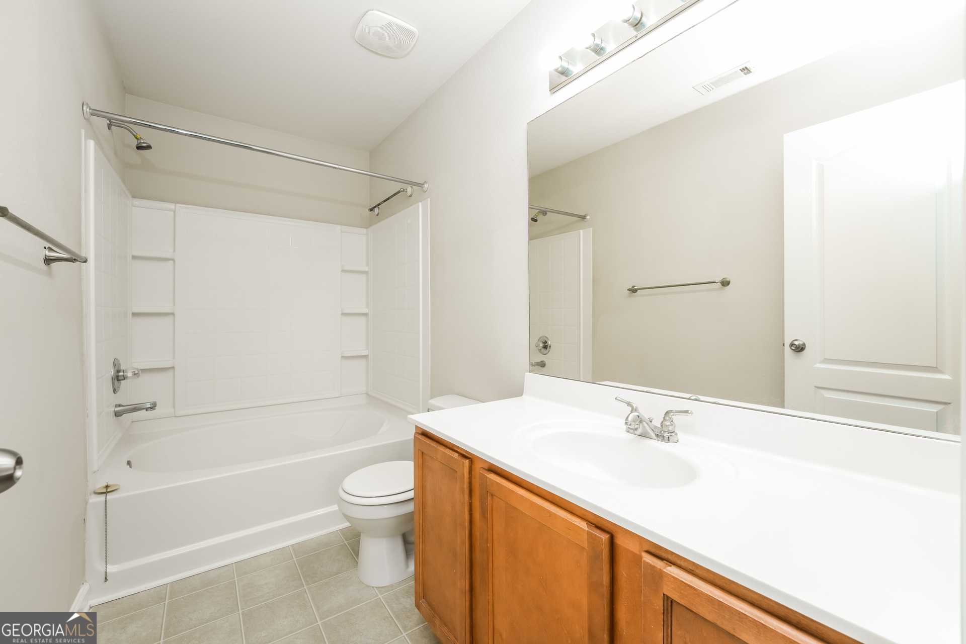 1259 Chinon Point Lithonia, GA 30058 - Photo 9 of 15 a bathroom with a sink a toilet and a bathtub