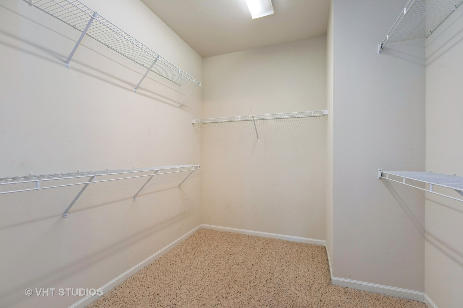 2836 Edgewater Drive Elgin, IL 60124 - Photo 16 of 35 a view of a room with racks on the wall