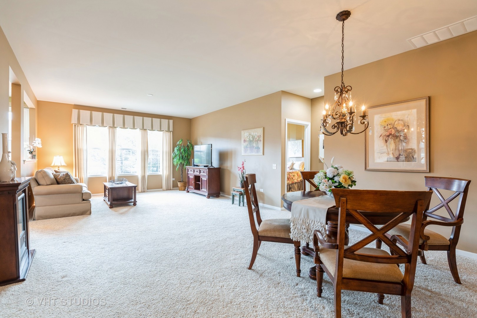 2836 Edgewater Drive Elgin, IL 60124 - Photo 8 of 35 a living room with furniture and a chandelier
