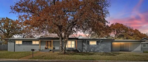 front view of house with a trees