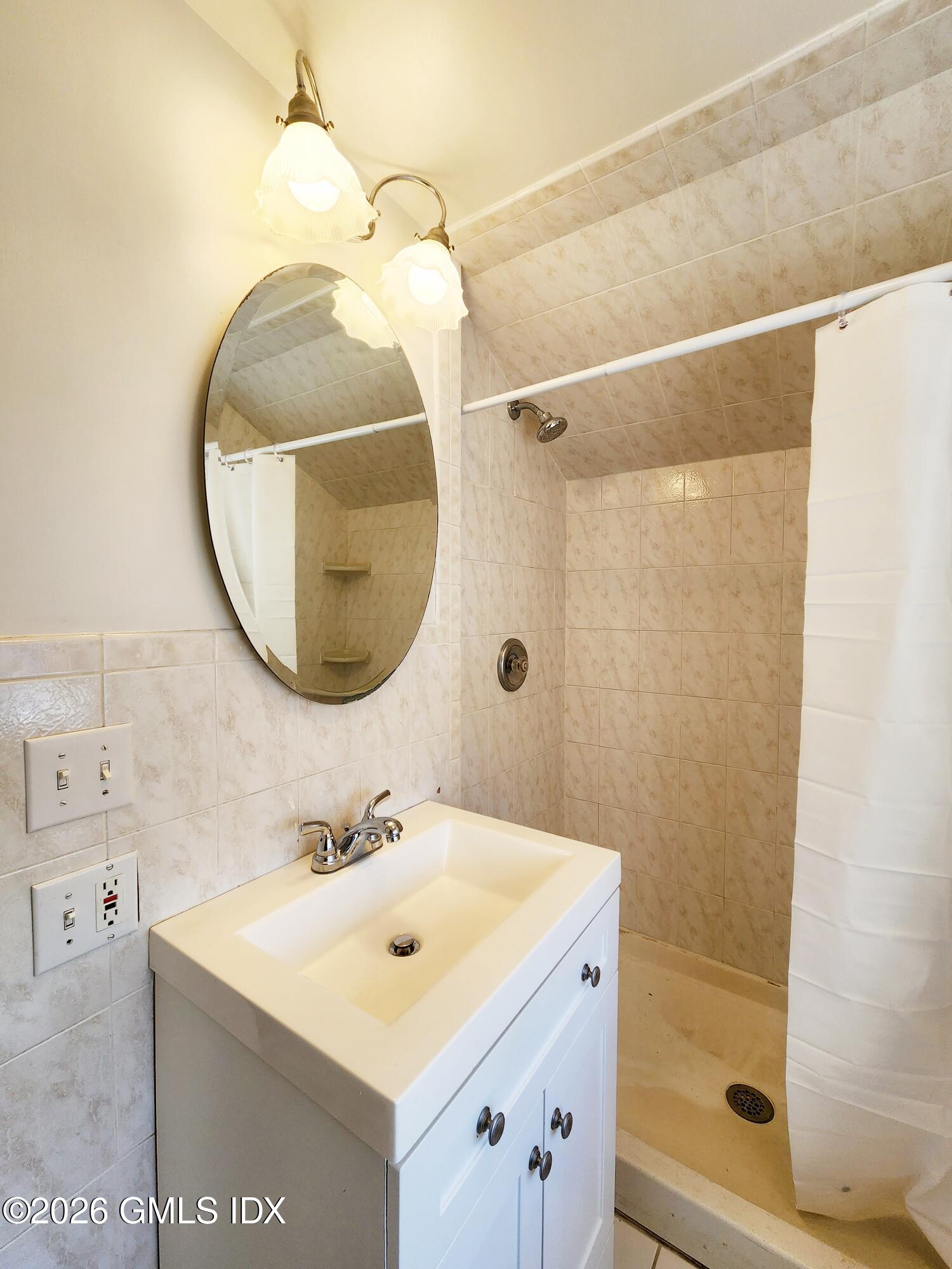 79 Valley Road Cos Cob, CT 06807 - Photo 14 of 20 a bathroom with a sink and a mirror