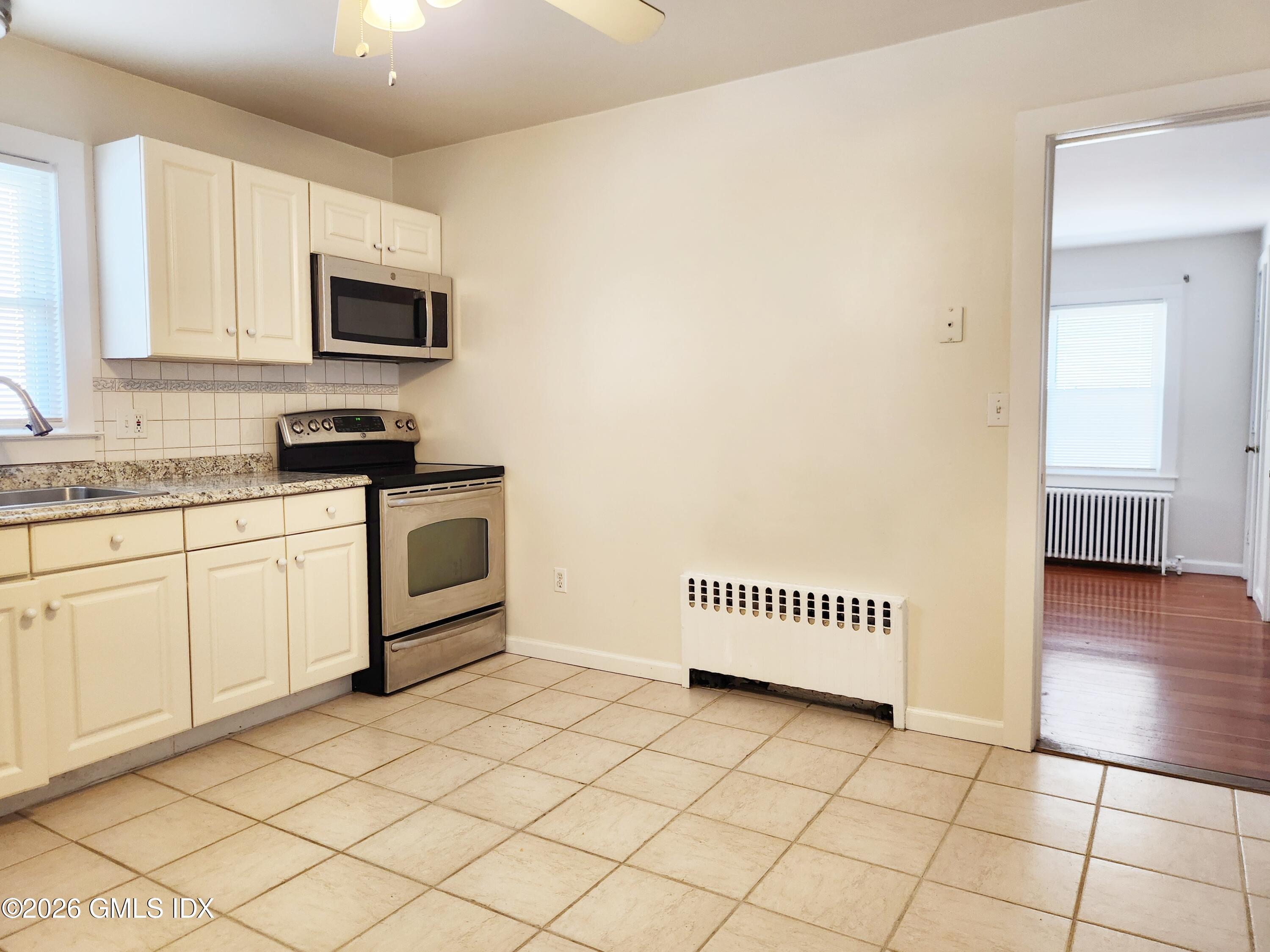 79 Valley Road Cos Cob, CT 06807 - Photo 5 of 20 a kitchen with a sink cabinets and appliances