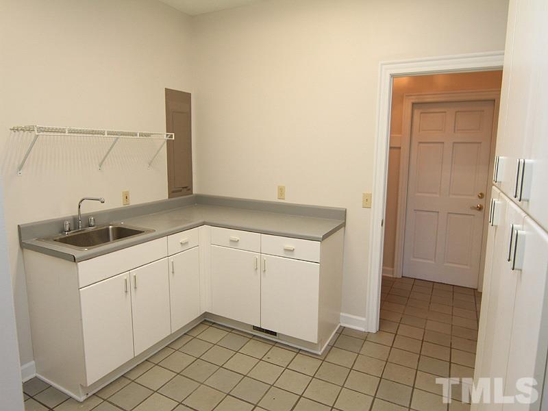 268 Log Barn Road Pittsboro, NC 27312 - Photo 14 of 25 Laundry Room has Ceramic Floors & Extra Cabinets for storing
