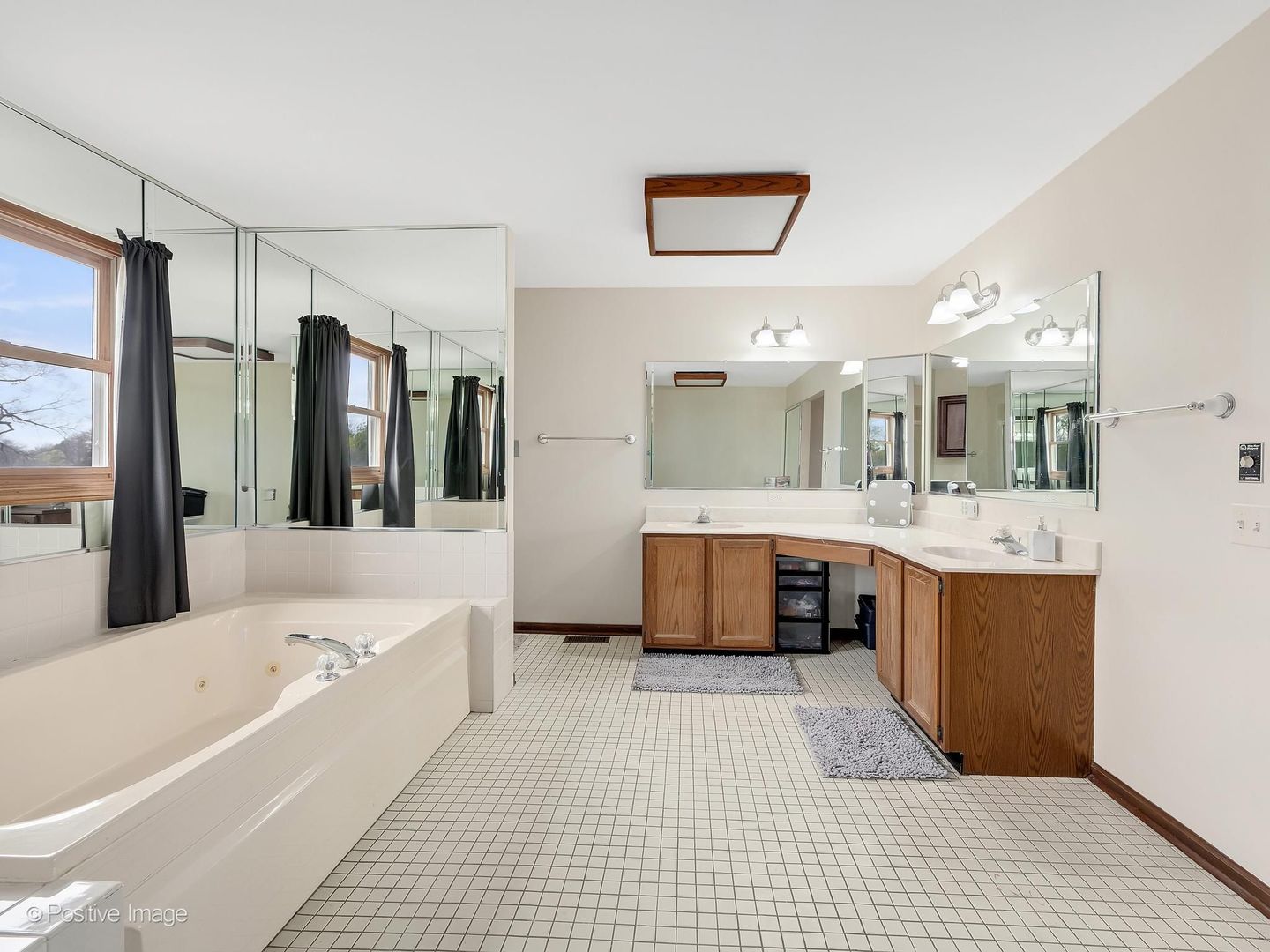 612 Stuart Drive Carol Stream, IL 60188 - Photo 18 of 29 a large spacious bathroom with a large tub shower and sink