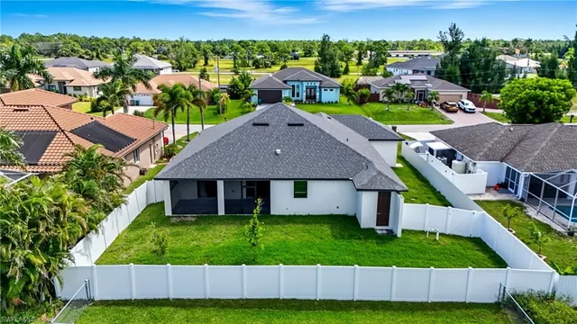 an aerial view of a house with a garden