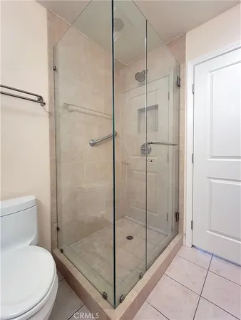a bathroom with a shower a toilet and sink