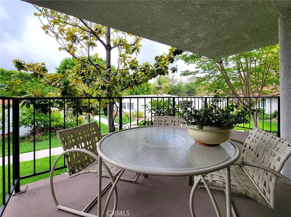 a view of a balcony with furniture
