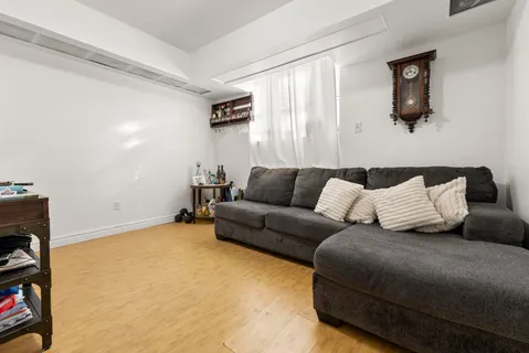 a living room with a couch and a flat screen tv