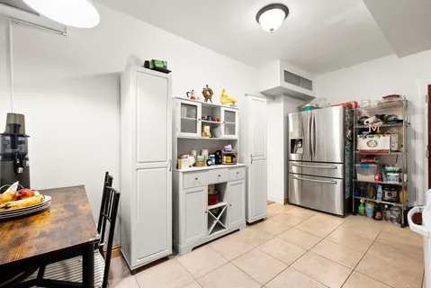 a kitchen with stainless steel appliances a refrigerator and a stove top oven
