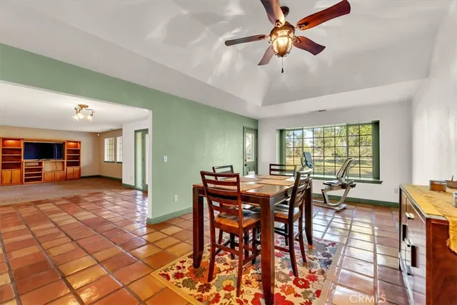 a view of a kitchen counter top space with furniture and wooden floor