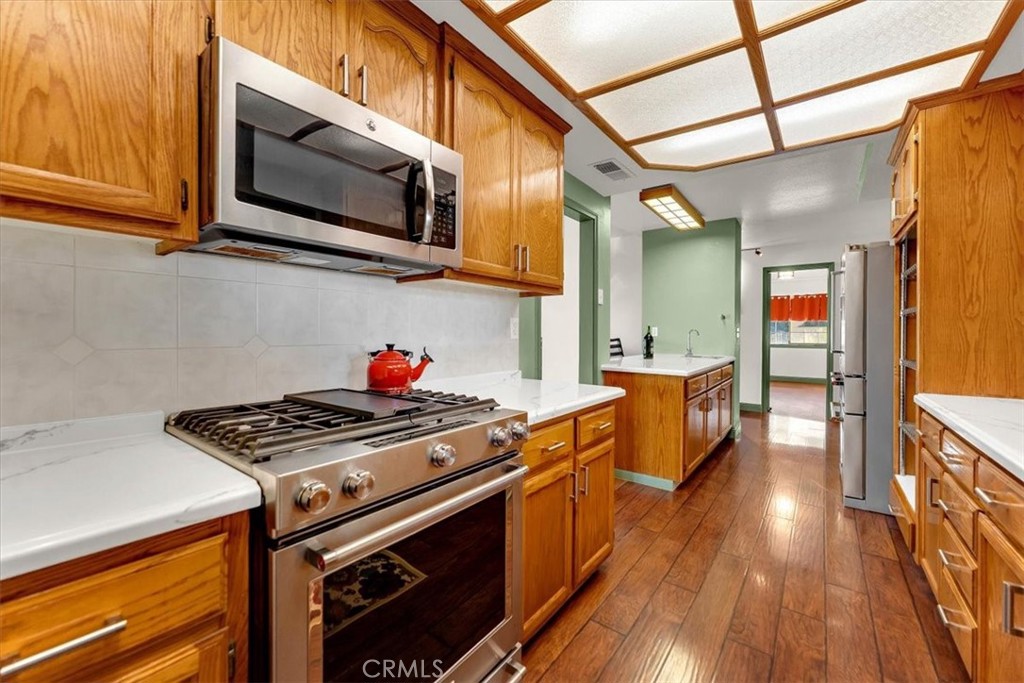 4730 Hall Corning, CA 96021 - Photo 18 of 70 a kitchen with stainless steel appliances granite countertop a stove and a microwave