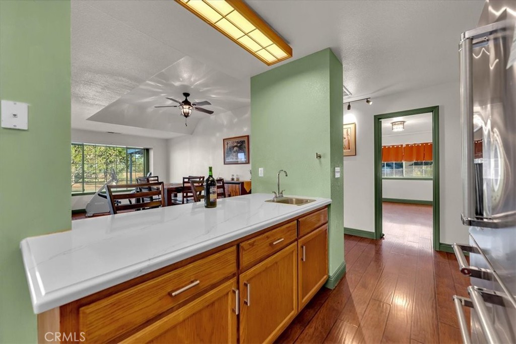 4730 Hall Corning, CA 96021 - Photo 20 of 70 a view of a kitchen counter top space with furniture and wooden floor