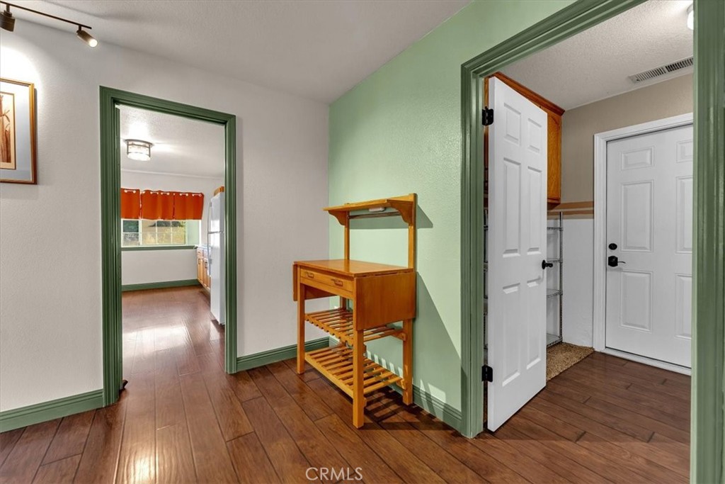 4730 Hall Corning, CA 96021 - Photo 21 of 70 a view of a hallway with wooden floor and stairs