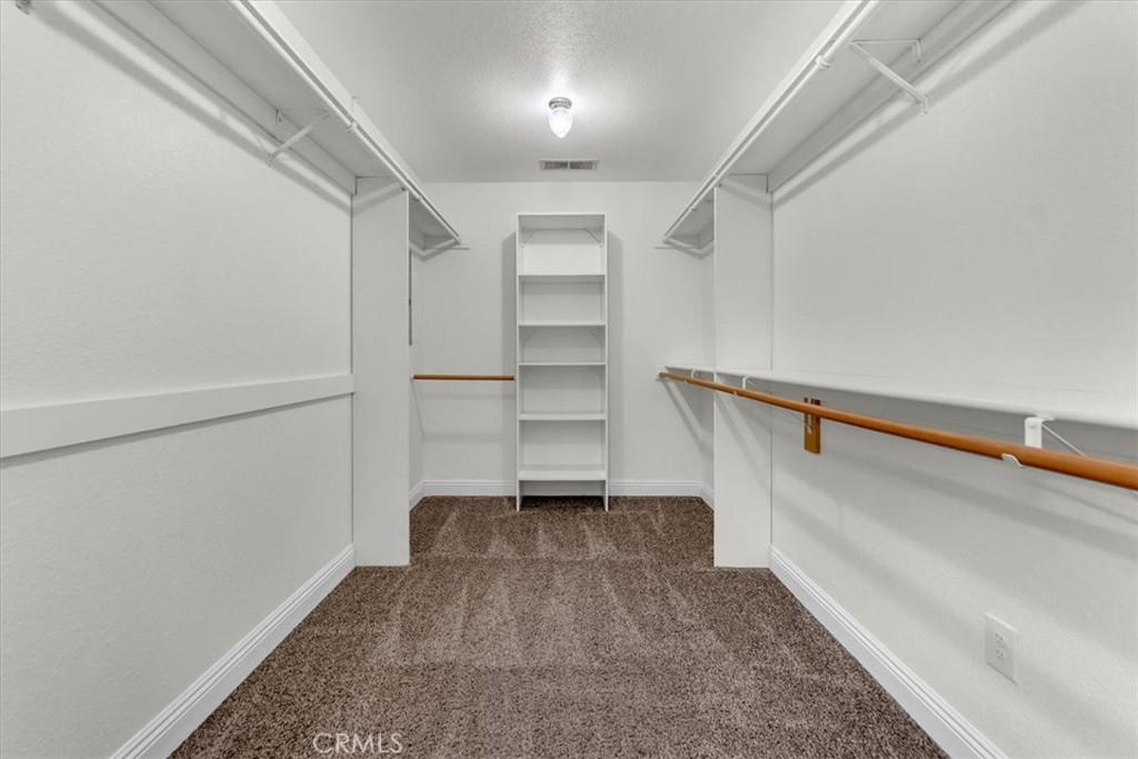4730 Hall Corning, CA 96021 - Photo 25 of 70 a view of walk in closet with empty racks