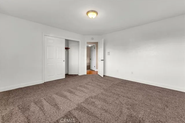 a kitchen with stainless steel appliances granite countertop a refrigerator and a stove