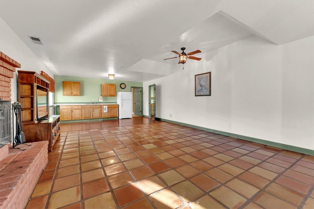 4730 Hall Corning, CA 96021 - Photo 41 of 70 a view of a hallway with wooden floor and a chandelier