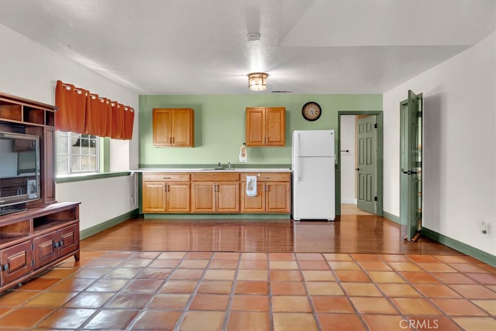 4730 Hall Corning, CA 96021 - Photo 42 of 70 a kitchen with stainless steel appliances granite countertop a refrigerator and a stove