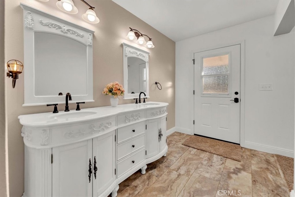 4730 Hall Corning, CA 96021 - Photo 47 of 70 a bathroom with a sink double vanity and a mirror
