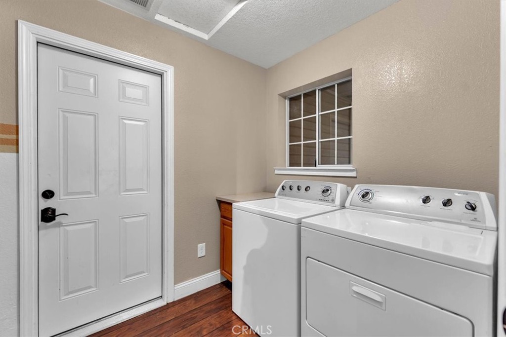 4730 Hall Corning, CA 96021 - Photo 49 of 70 a view of washer and dryer with wooden floor