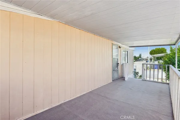 a bathroom with a granite countertop toilet sink and mirror
