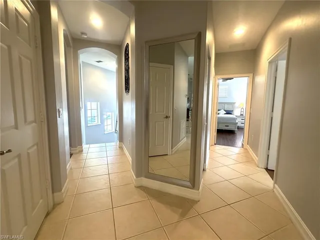 a bathroom with a glass shower door and a bathroom sink