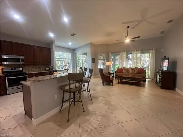 a large kitchen with lots of counter space and windows