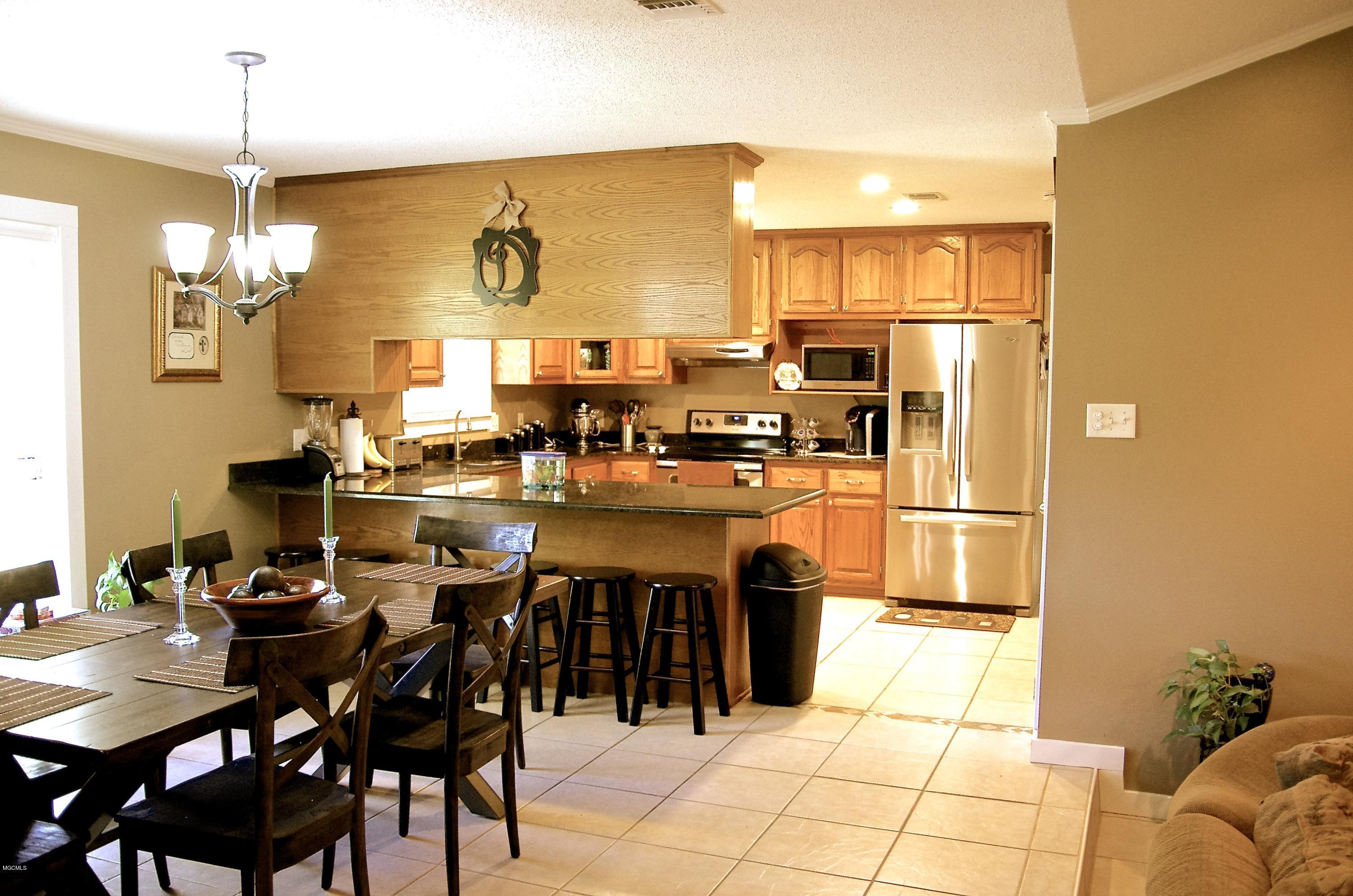 13628 Wolf River Road Gulfport, MS 39503 - Photo 18 of 47 Dining Room/Kitchen