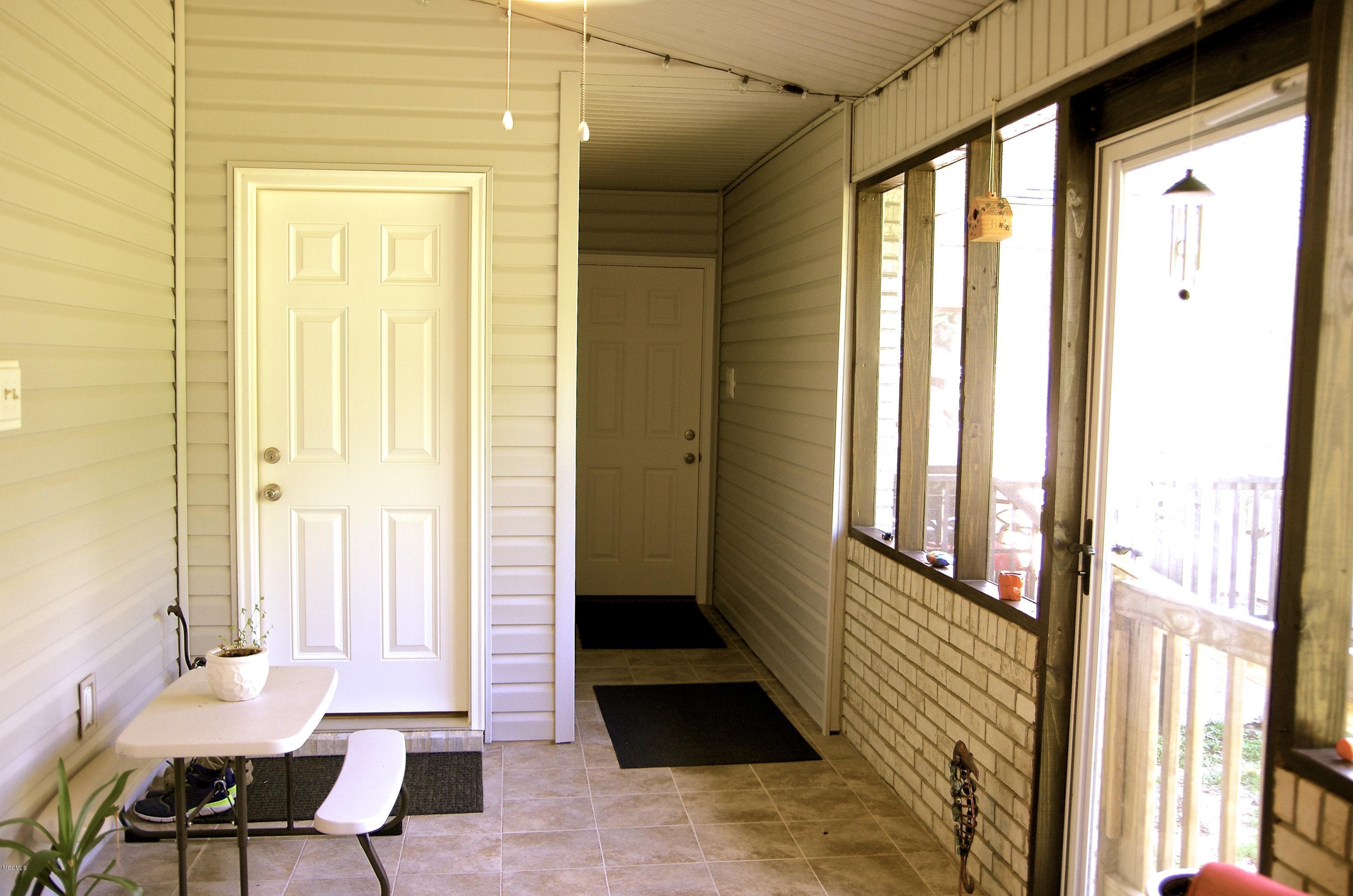 13628 Wolf River Road Gulfport, MS 39503 - Photo 37 of 47 Enclosed Covered Back Porch