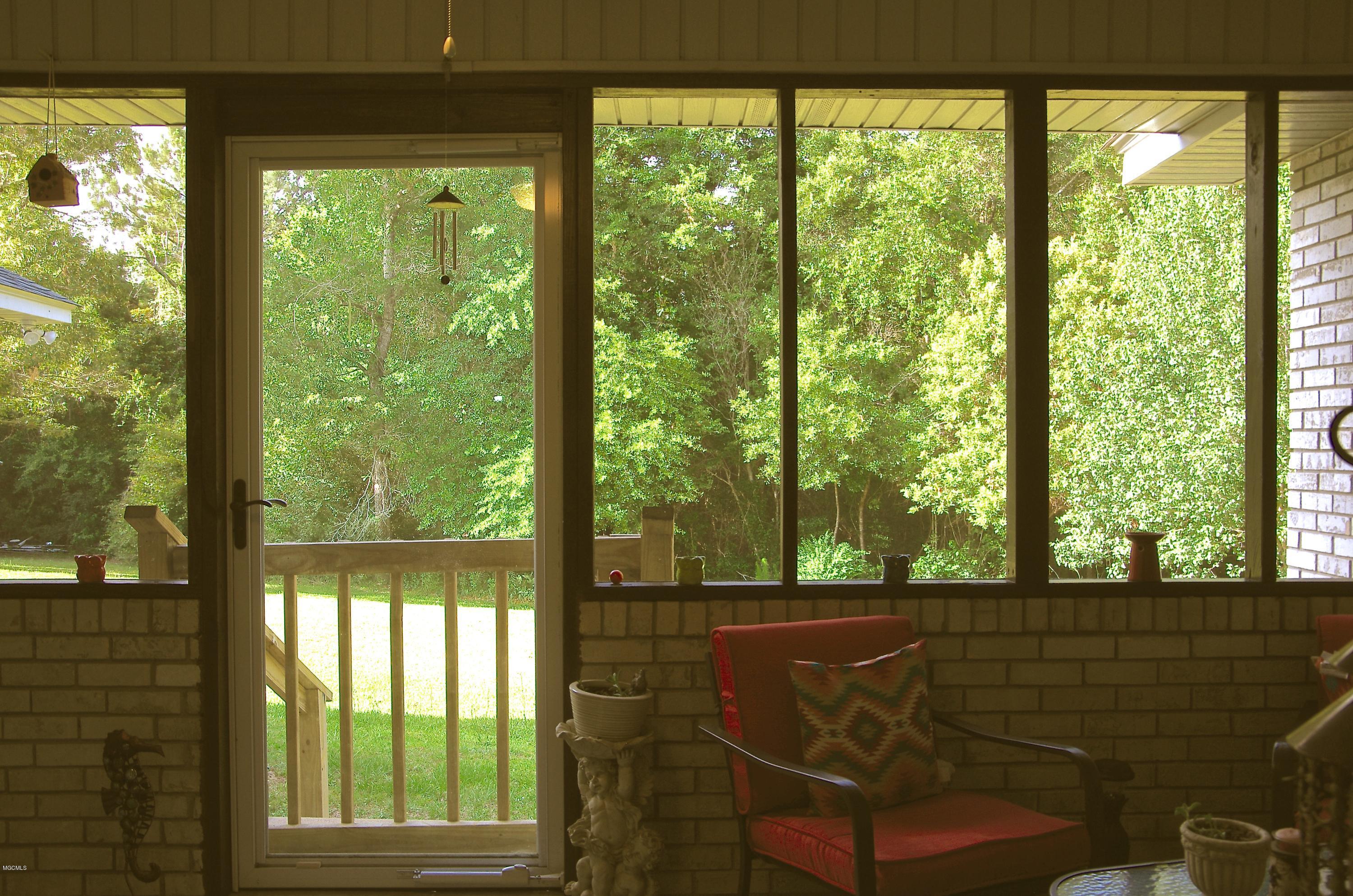 13628 Wolf River Road Gulfport, MS 39503 - Photo 38 of 47 Enclosed Covered Back Porch