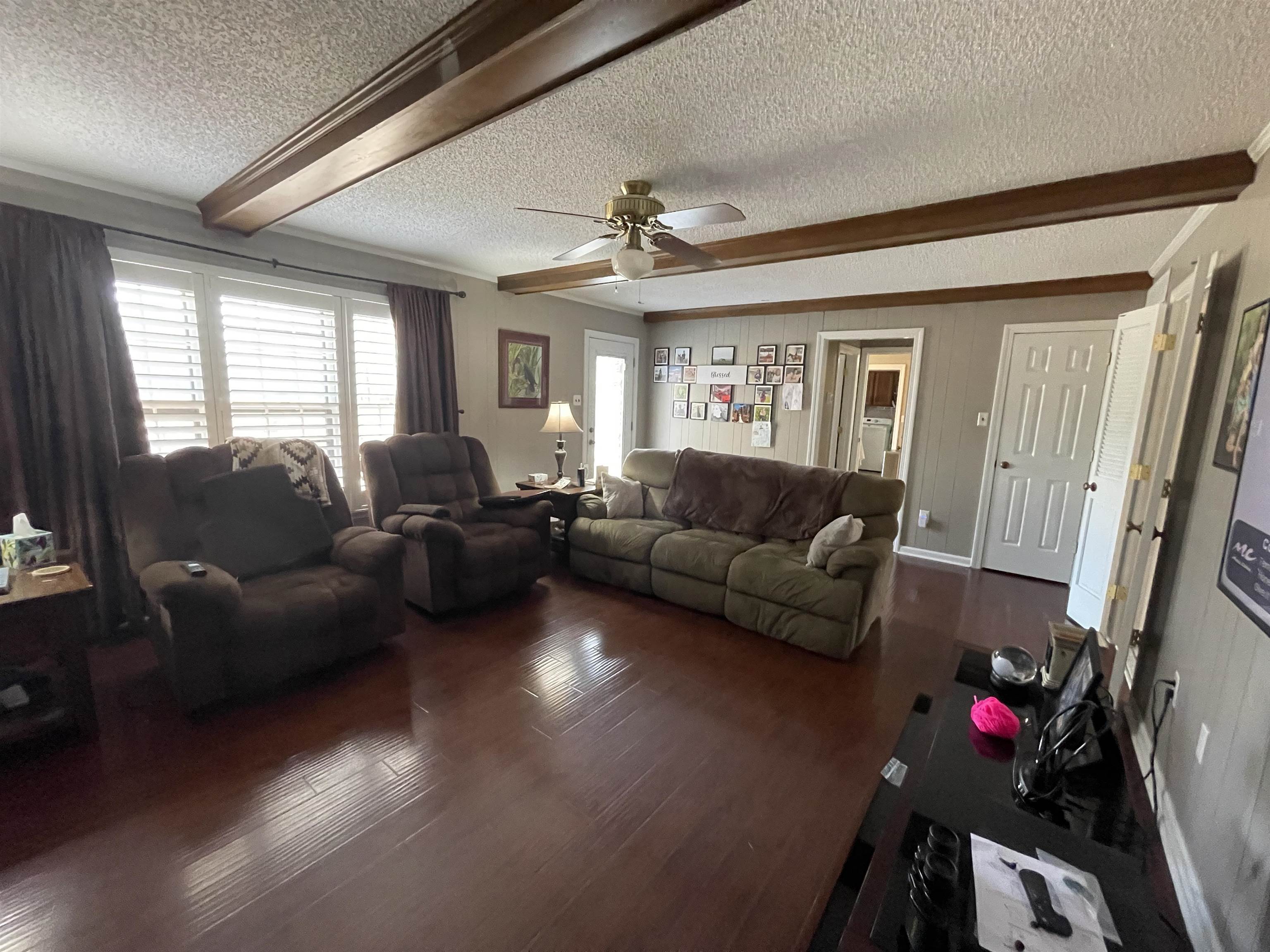 4580 Shadowlawn Road Bartlett, TN 38002 - Photo 13 of 37 a living room with furniture a flat screen tv and a large window