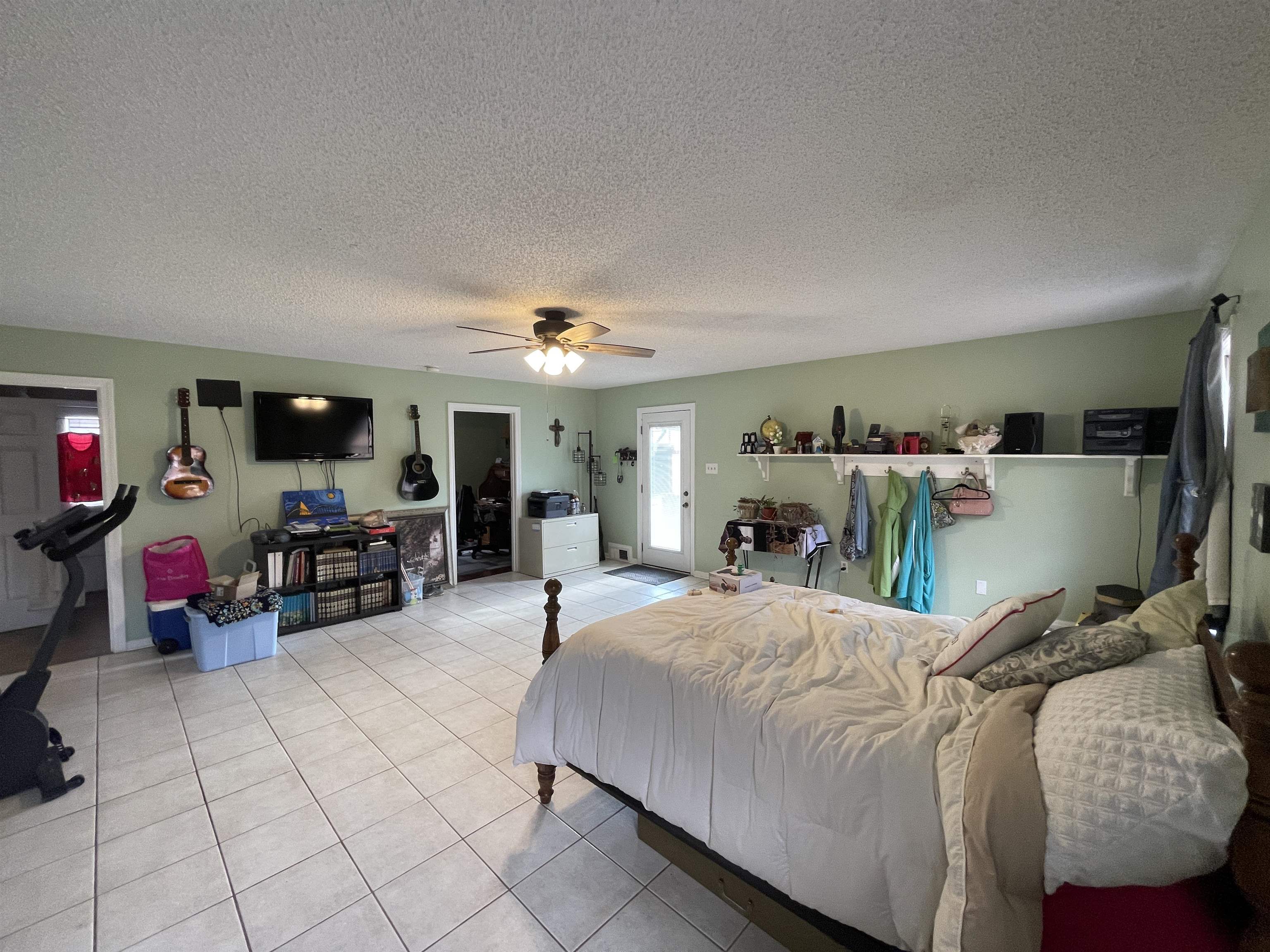 4580 Shadowlawn Road Bartlett, TN 38002 - Photo 17 of 37 a bedroom with furniture and a flat screen tv