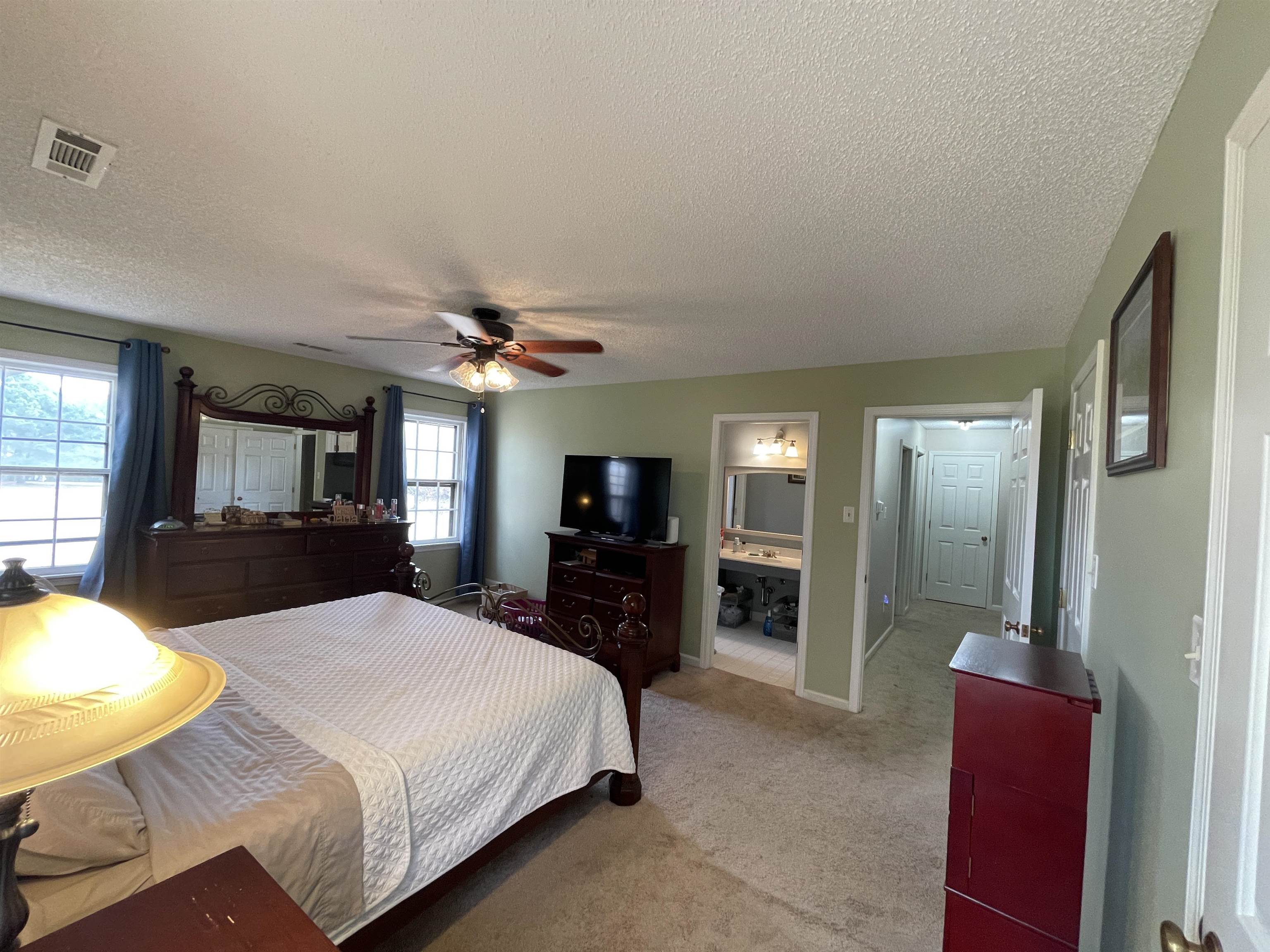 4580 Shadowlawn Road Bartlett, TN 38002 - Photo 20 of 37 a bedroom with a bed and a flat screen tv