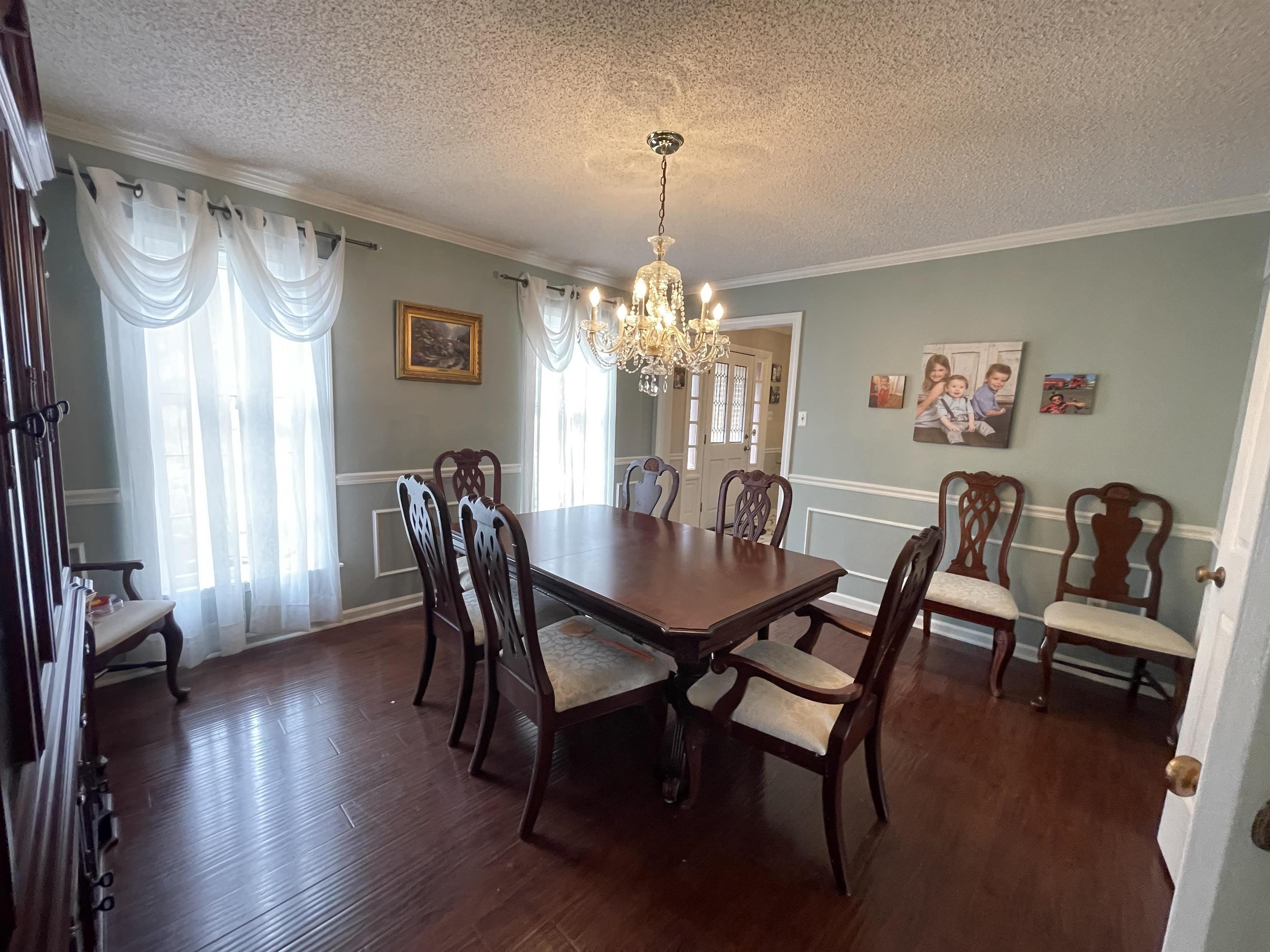4580 Shadowlawn Road Bartlett, TN 38002 - Photo 7 of 37 a view of a dining room with furniture window and wooden floor
