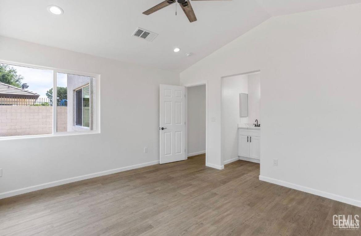 Undisclosed Address Bakersfield, CA 93313 - Photo 11 of 11 a view of an empty room with a window