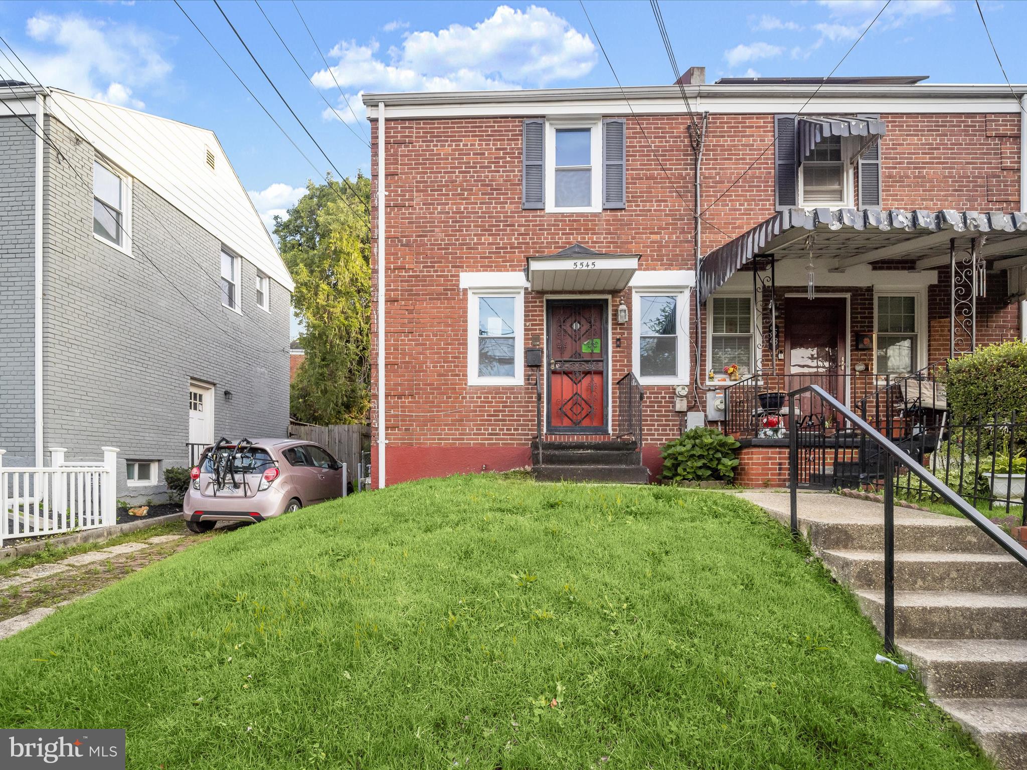 5545 Bass Place Southeast Washington, DC 20019 - Photo 1 of 35 a front view of a house with garden