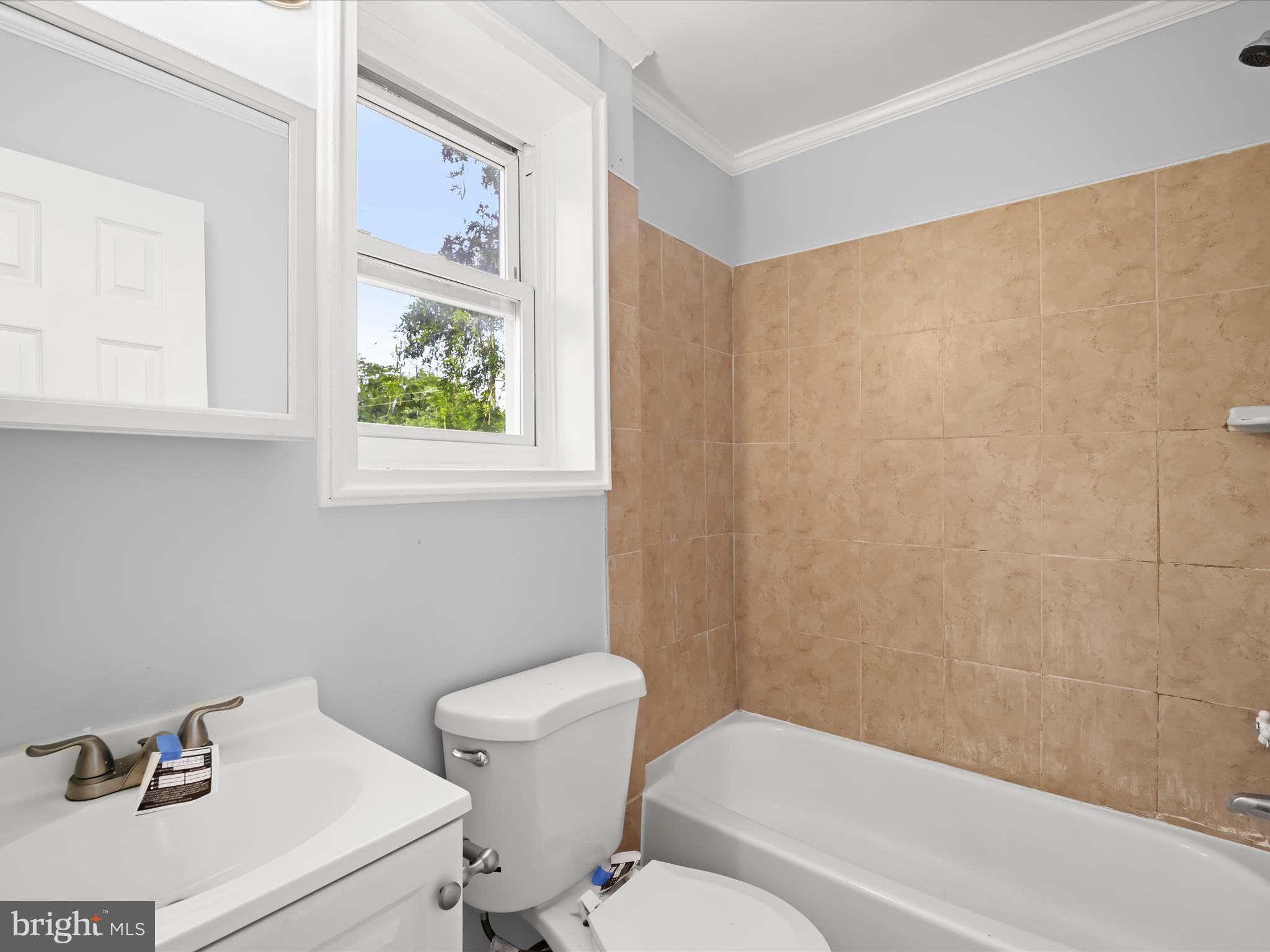5545 Bass Place Southeast Washington, DC 20019 - Photo 14 of 35 a bathroom with a sink and a mirror
