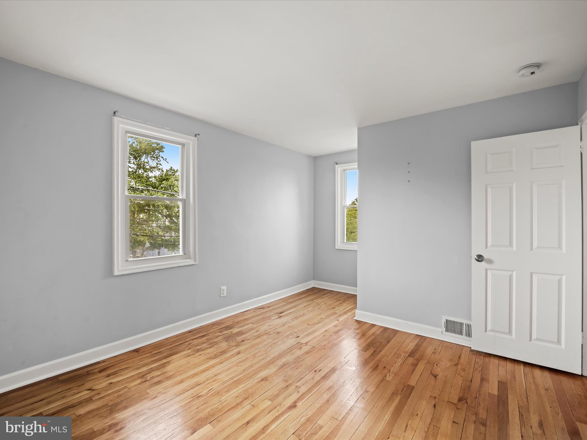 5545 Bass Place Southeast Washington, DC 20019 - Photo 16 of 35 a view of empty room with wooden floor and fan