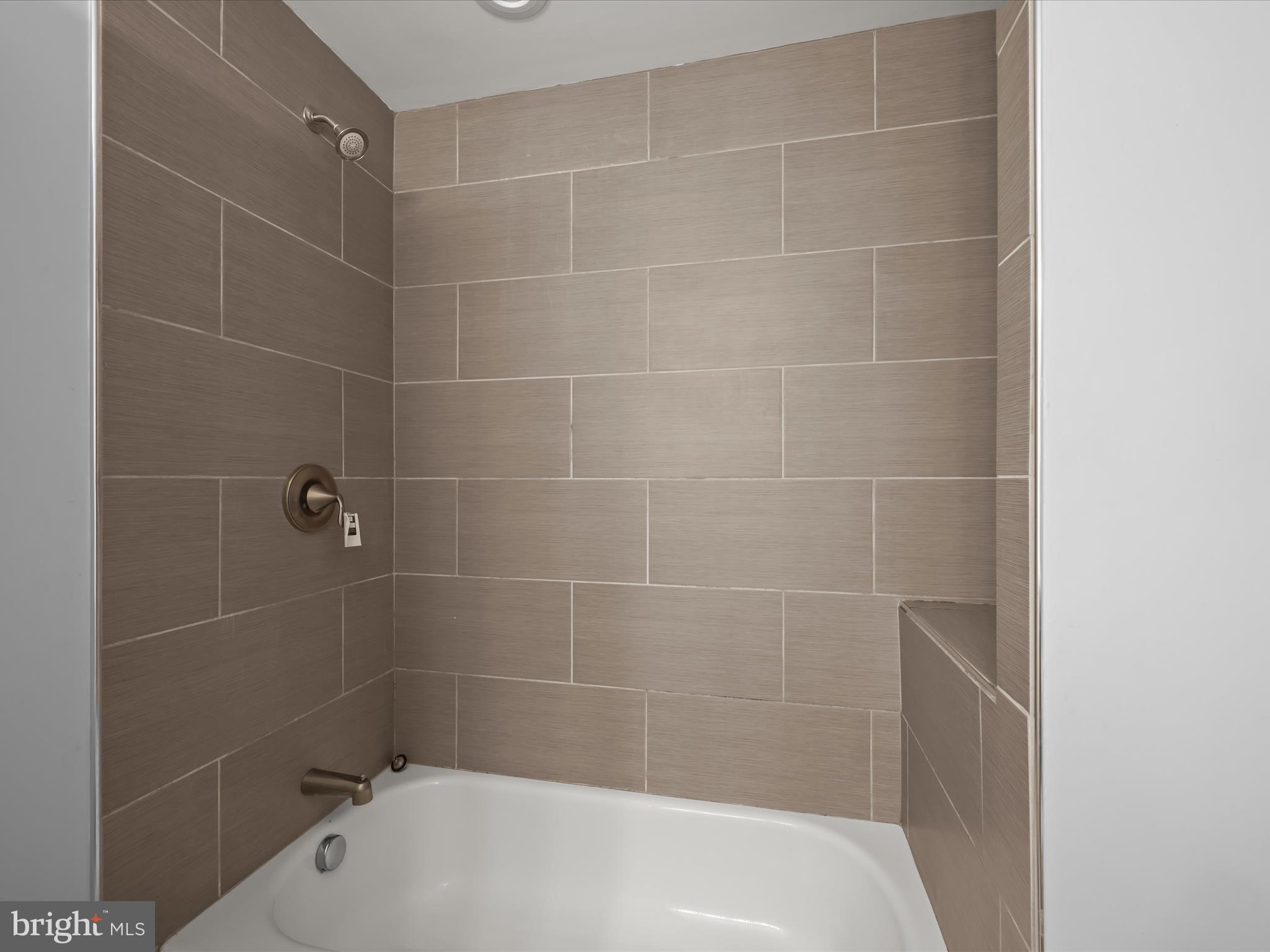 5545 Bass Place Southeast Washington, DC 20019 - Photo 19 of 35 a bath tub sitting next to a white sink